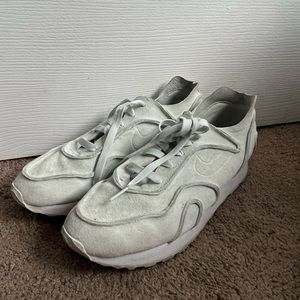 Pastel green velvet Nike sneakers